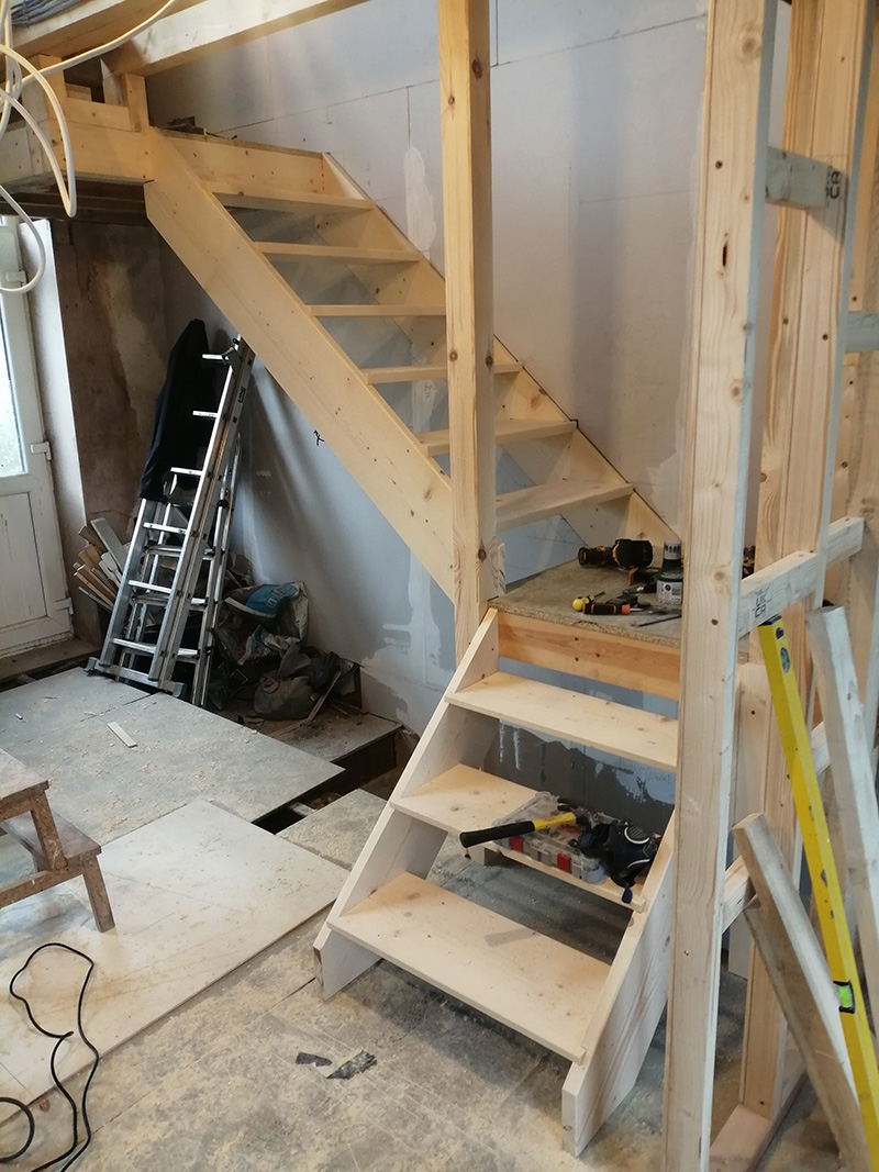 View of staircase construction showing 180-degree turn