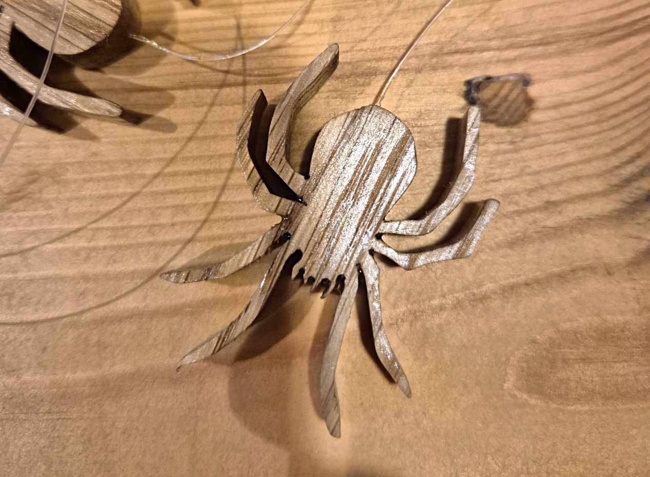 Brown spider carved from Oak for the spider mobile
