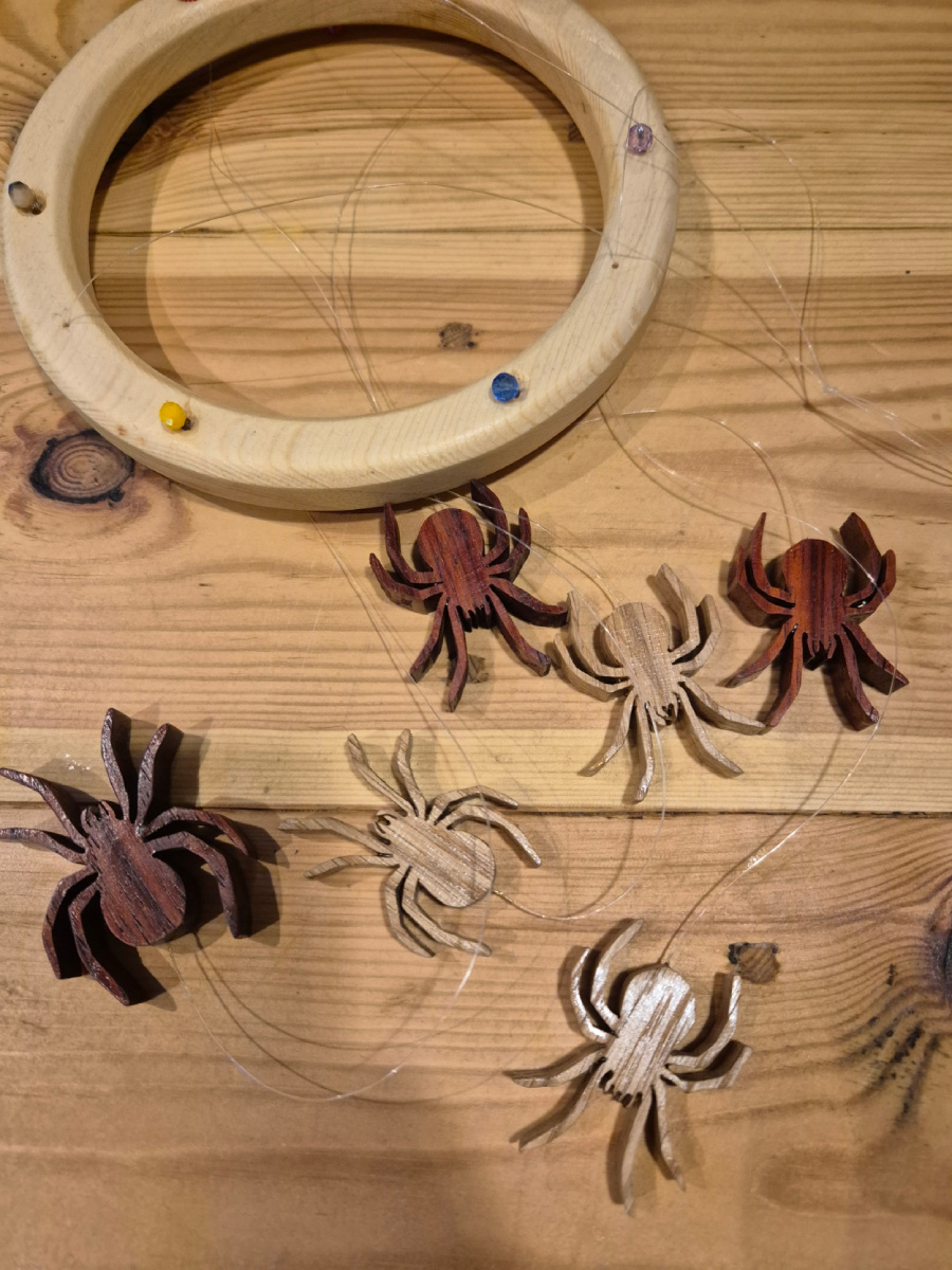Collapsed spider mobile showing the individual spiders and hanging mechanism