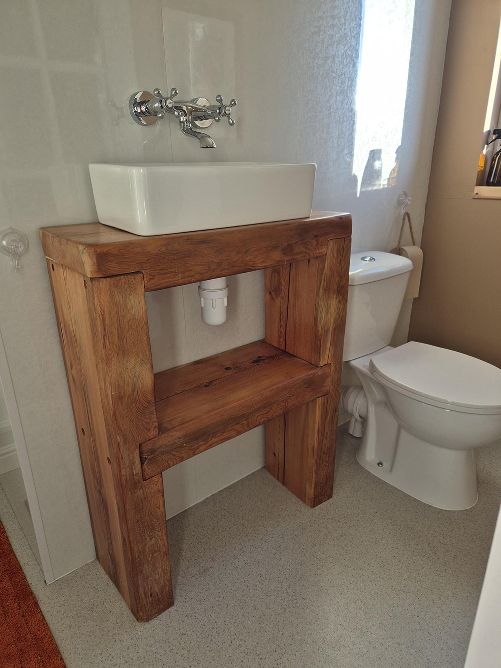 The finished sink stand made from a reclaimed roof purlin