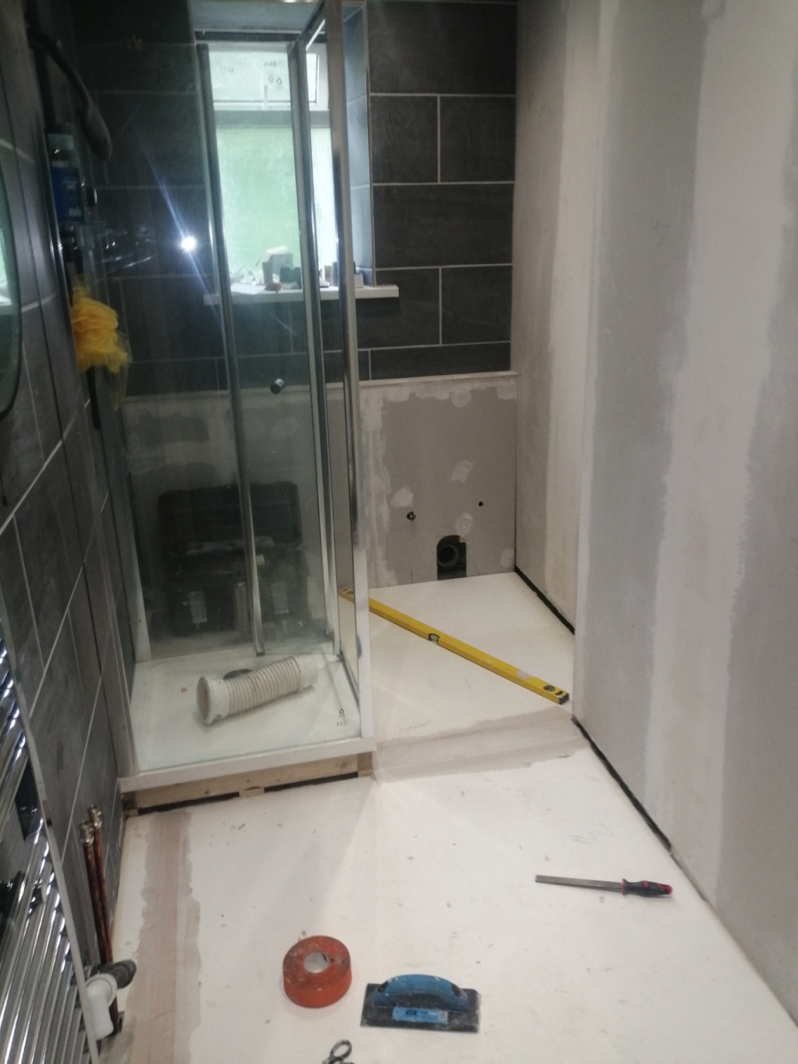 Halfway through the small bathroom renovation with single shower cubicle