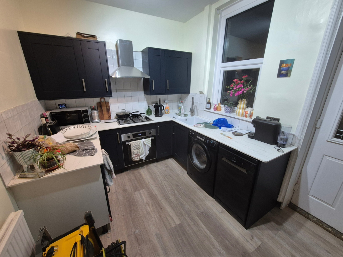 Fully fitted Wicks kitchen, tiled, decorated and laminate flooring complete