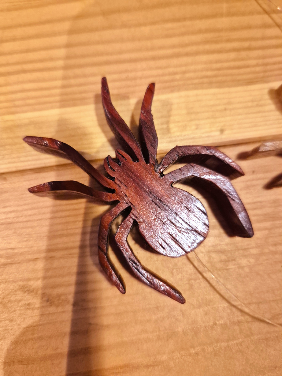 Red spider carved from Rosewood for the spider mobile