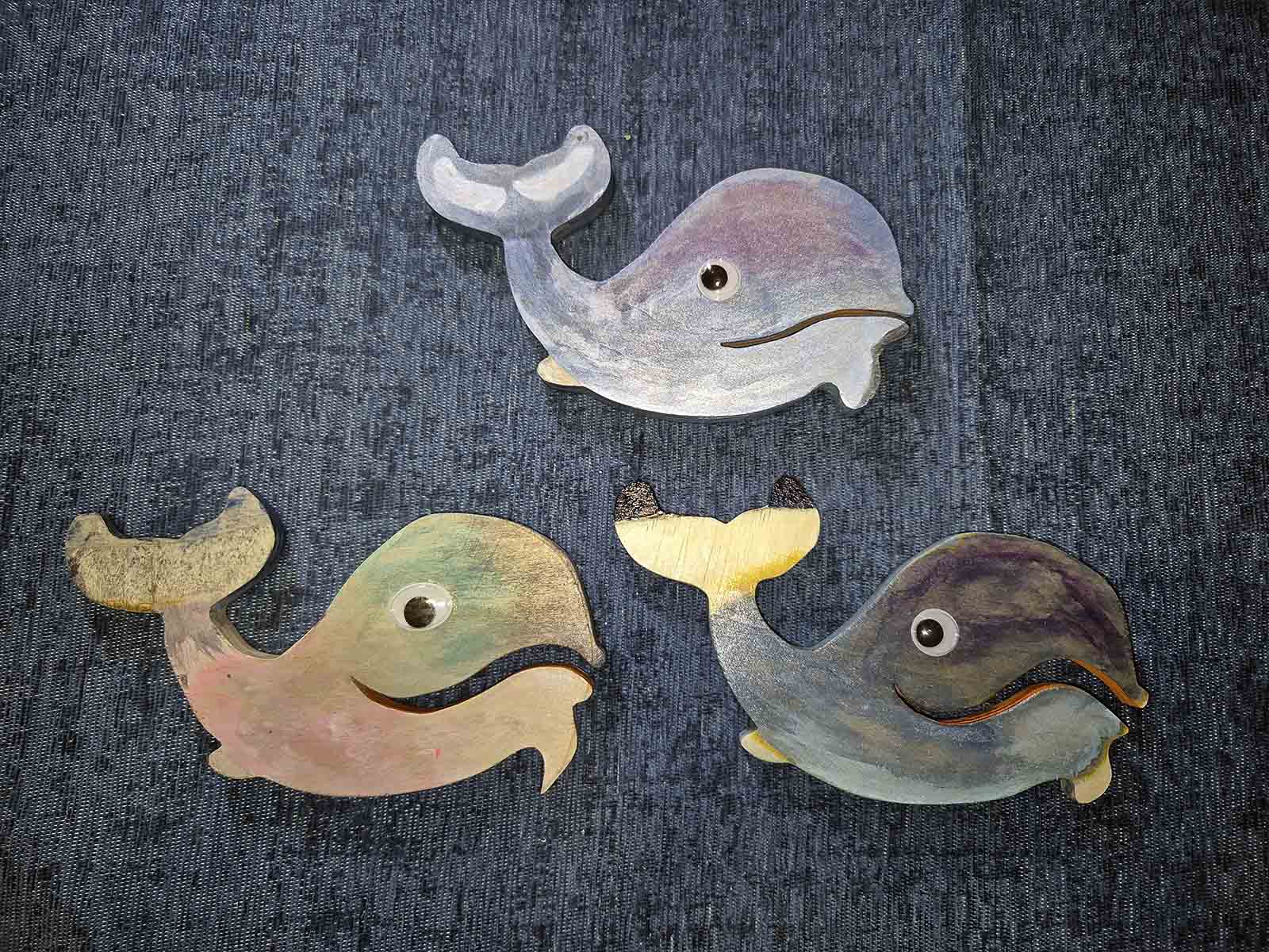 Reverse side of three whales